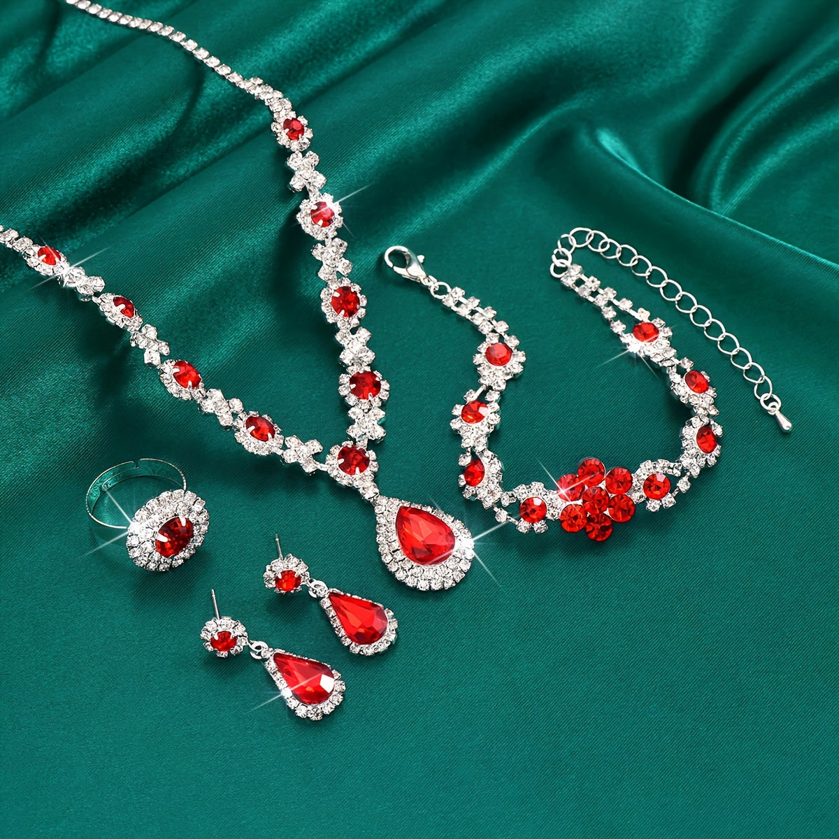 This jewelry set features a vintage 4-piece design with synthetic gemstones, a sexy tear-drop style, and a silver plated finish with rhinestones. Made from copper, this set is perfect for vacation and wedding events, and makes an ideal gift for