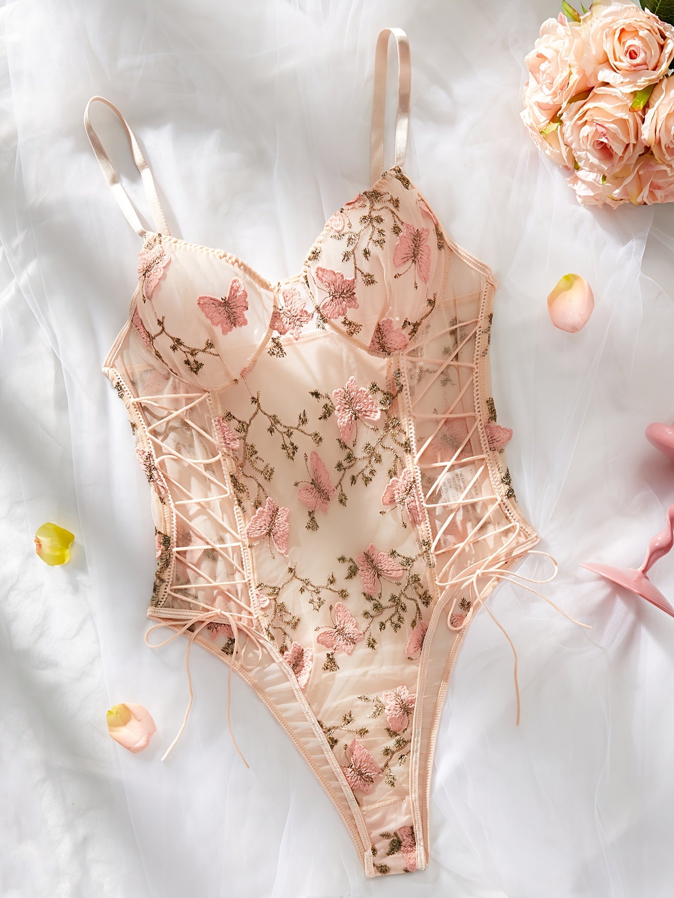 Butterfly embroidered teddy and sheer floral bodysuit, perfect for intimate wear and boudoir.