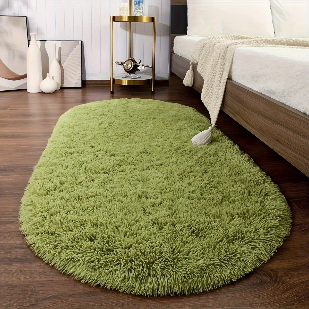 Soft and fluffy oval shaggy area rug, perfect for bedroom or living room. Made with skin-friendly thickened sponge and tufted polyester material. Durable and easy to maintain. Adds decorative touch to indoor spaces such as sofa, bedside, playroom, or