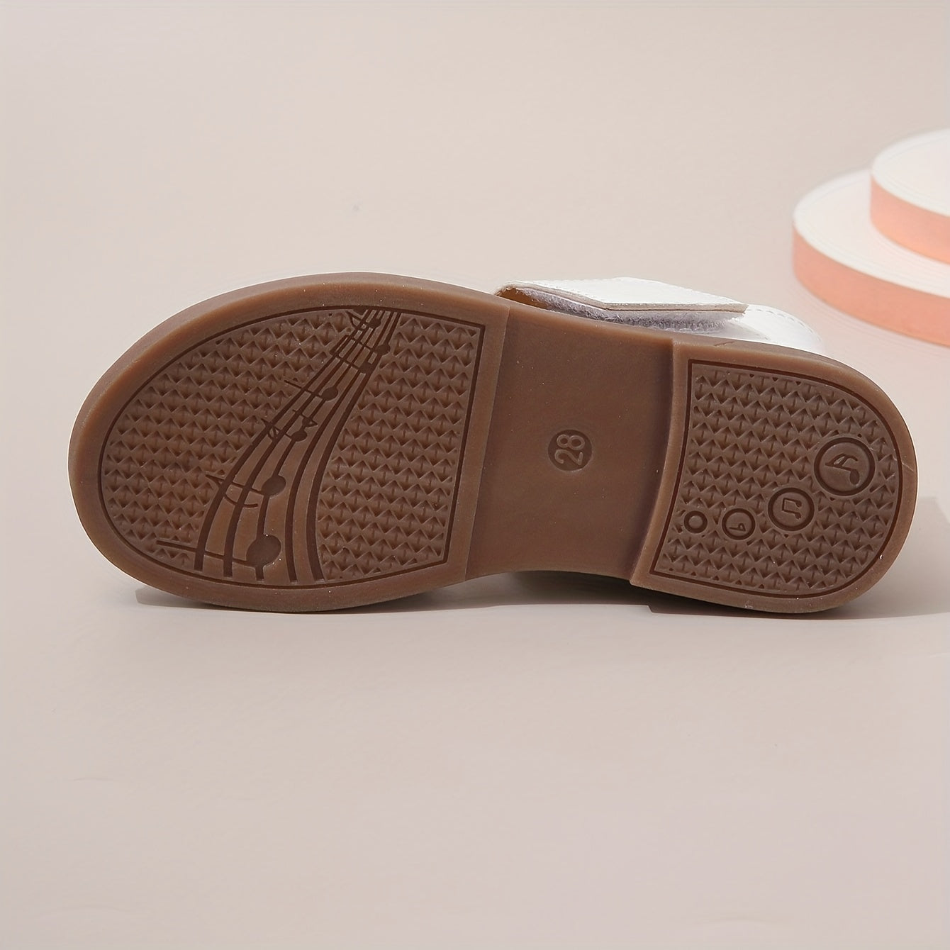 Stylish summer sandals for girls: open-toe design with braided straps and flat sole, ideal for casual wear and festivals.