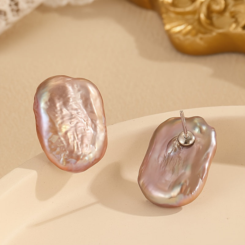 Vintage-style freshwater pearl stud earrings weighing 3.85g, featuring elegant S925 silvery posts. Ideal for casual wear or as a thoughtful gift.