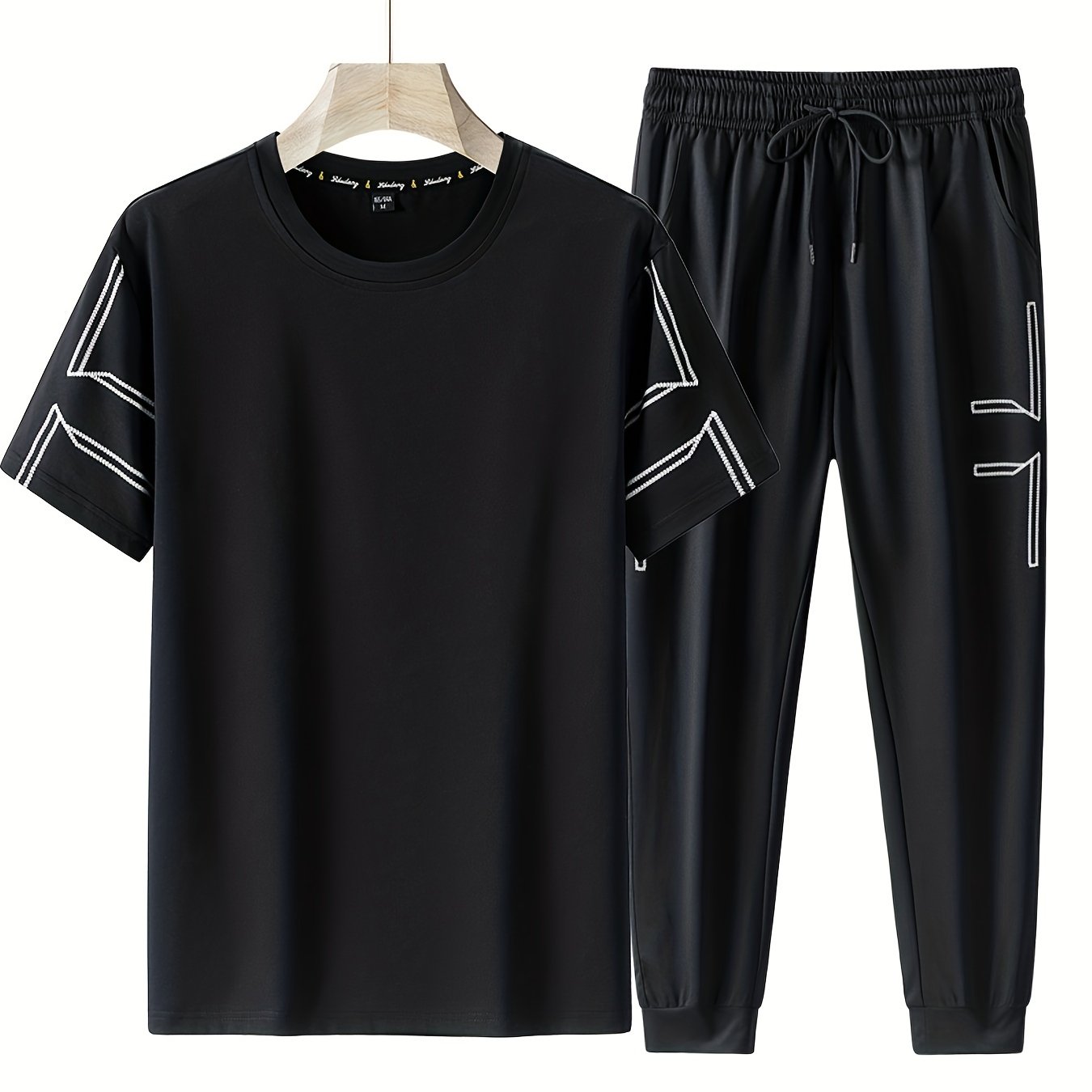 Men's 2 piece outfits with geometric line pattern t-shirt and drawstring jogger pants.