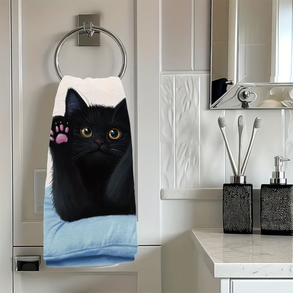 This pair of ultra-soft kitchen towels showcases a black cat stretching on a pillow, with its front paws and pink claws on display. These highly absorbent dish towels are ideal for holiday decoration and can be easily machine washed. The towels measure