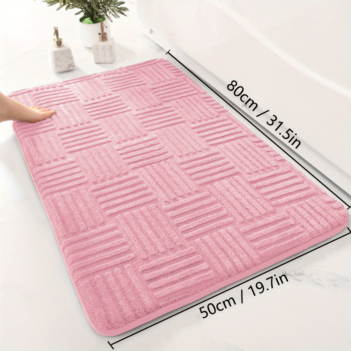 One piece of a thickened bathroom absorbent mat with a non-slip bathtub rug. Can also be used as a home entryway carpet with a solid color and stripe pattern. The mat is rectangular in shape and lightweight, machine-made with a PVC backing. Made of