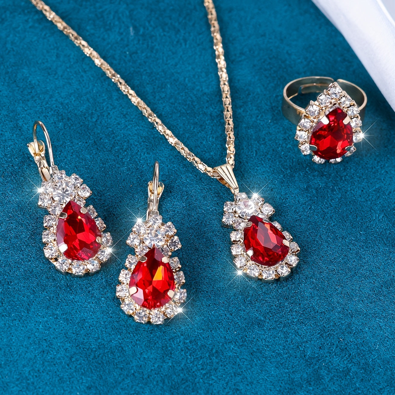 Complete your look with this elegant jewelry set featuring 4 pieces - earrings, necklace, and ring. Made with 18k gold plating and inlaid with shimmering zirconia in multiple colors to suit your style. Perfect for daily wear or adding a touch of glamour