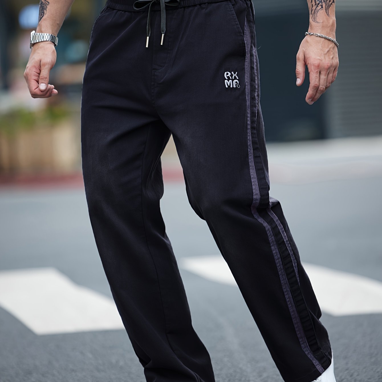 Men's cotton blend label decor straight leg pants with drawstrings for casual sports in spring and fall.