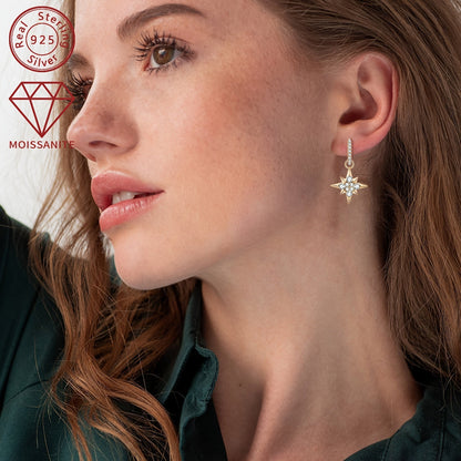 This pair of women's fashion dangling earrings features a total weight of 4.39g and is adorned with 8 pieces of 3mm moissanite stones, 8 pieces of 2mm moissanite stones, and 2 pieces of 0.52 carat moissanite stones. The earrings are crafted in 925