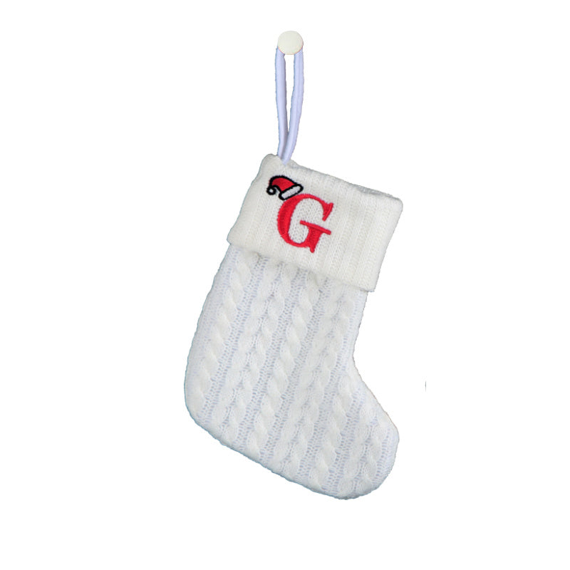 White cable knit stocking with embroidered 'F' - Ideal for indoor decor.