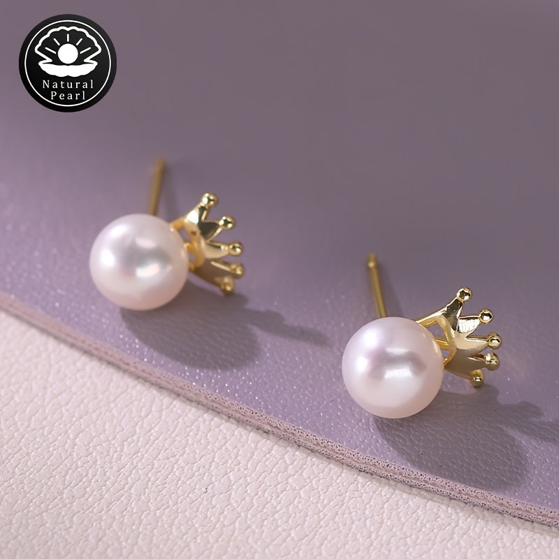 These MUFAN Elegant Luxury Stud Earrings feature a pair of 7-8mm Flat Round Natural Freshwater Pearls adorned with a Small Crown design. They are the perfect June Birthstone accessory for daily wear or gifting, making them a versatile choice for all