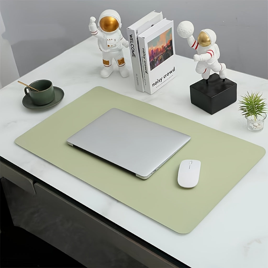 Waterproof faux leather desk pad with anti-slip surface for office and home use. Measures 59.99 x 32.99 cm. Rectangular mouse pad for workspace protection. Sleek and easy to clean design.