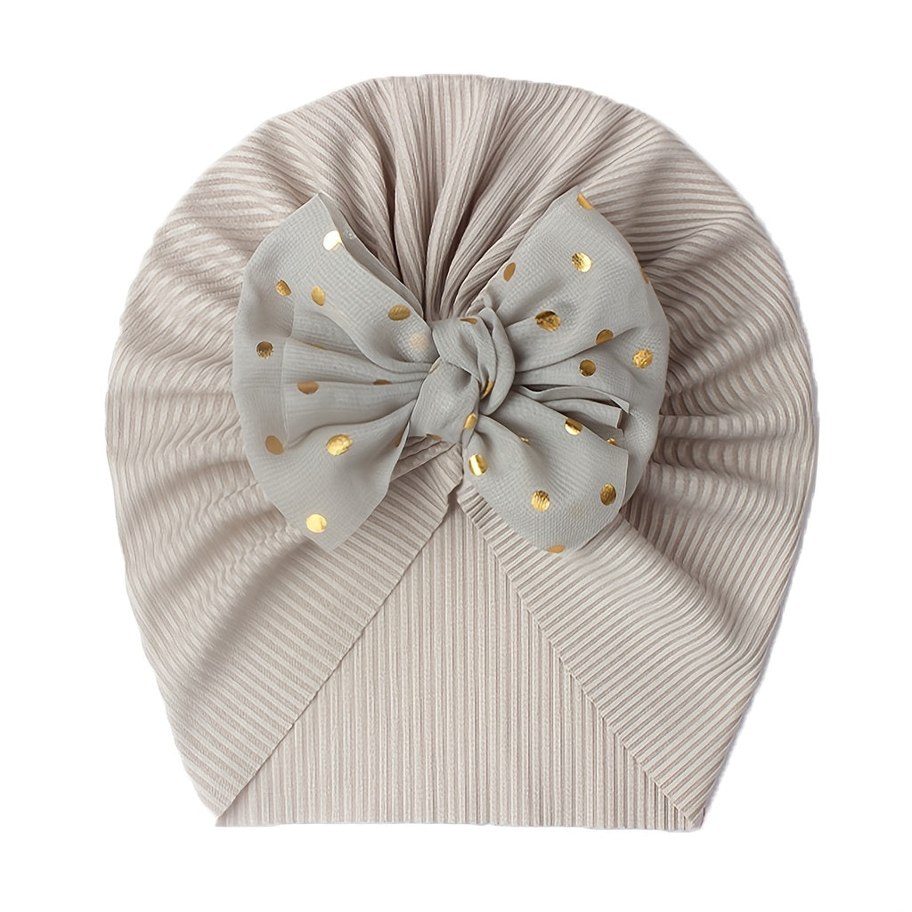 Polka dot printed bow head wrap for newborn infants and toddlers.