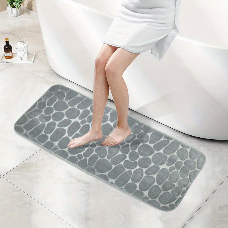 SoftTouch Cobblestone Pattern Memory Foam Bath Mat is machine washable and non-slip, making it a perfect addition to any bathroom. The absorbent polyester material resists stains, making it ideal for use in the bathtub or kitchen. This home decor runner