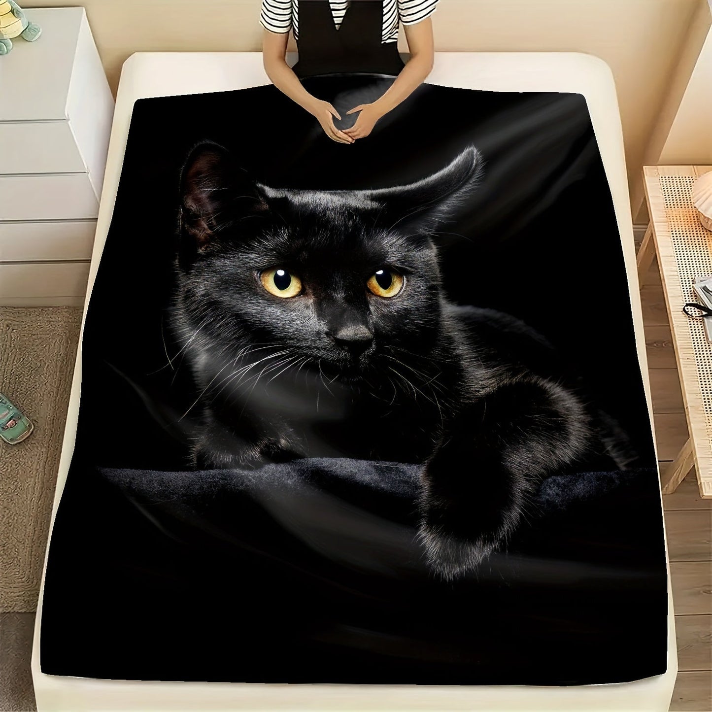 Soft and warm, this black cat print flannel blanket is perfect for cuddling up on the couch, in the office, or while camping or traveling. It also makes a great holiday gift for anyone who loves cozy blankets.