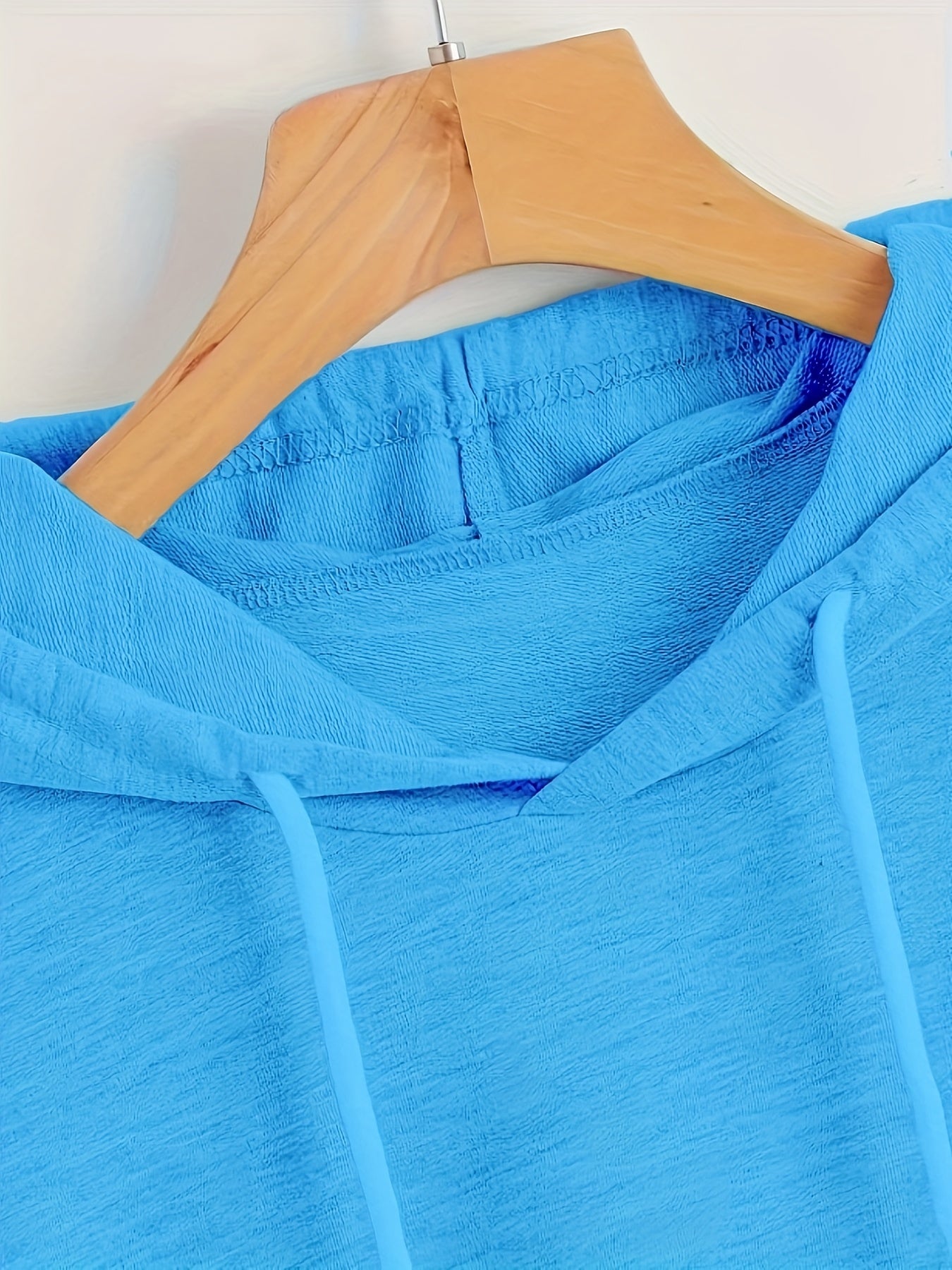 Oversized hooded T-shirt made of polyester/spandex fabric, suitable for casual sportswear in spring/summer/fall.