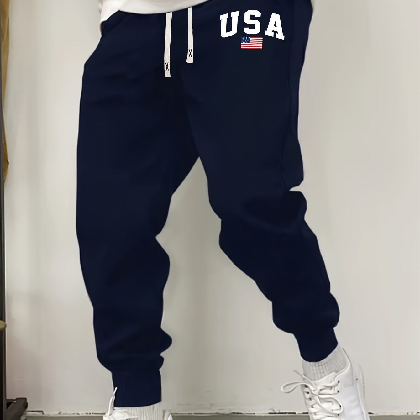 Men's casual knit sweatpants with USA flag print, elastic waist and drawstring for outdoor activities.