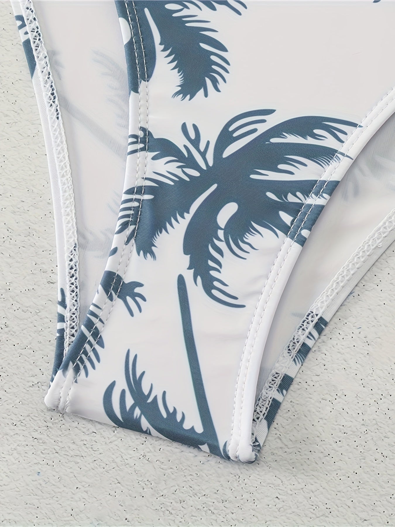 Padded bra swimsuit with palm tree print.