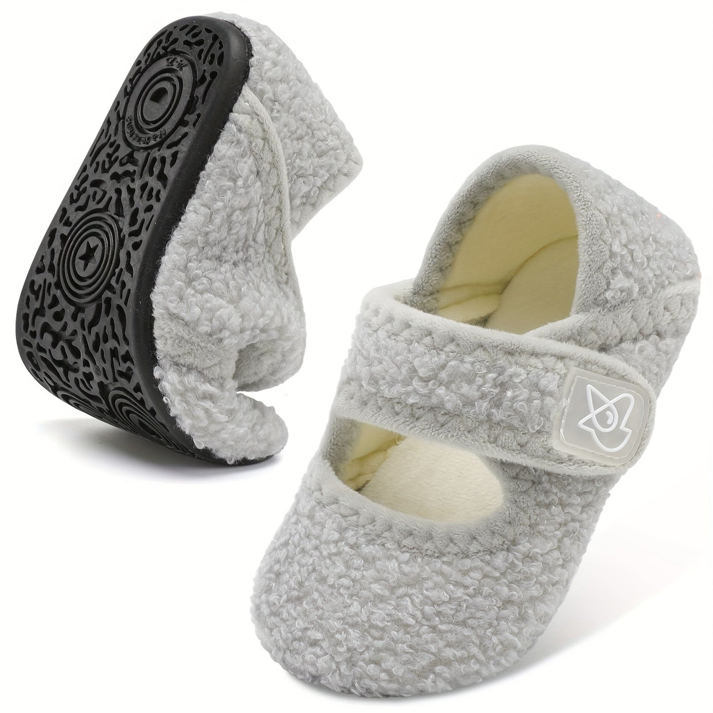 Cozy cartoon house shoes for children, warm and nonslip for indoor winter walking.