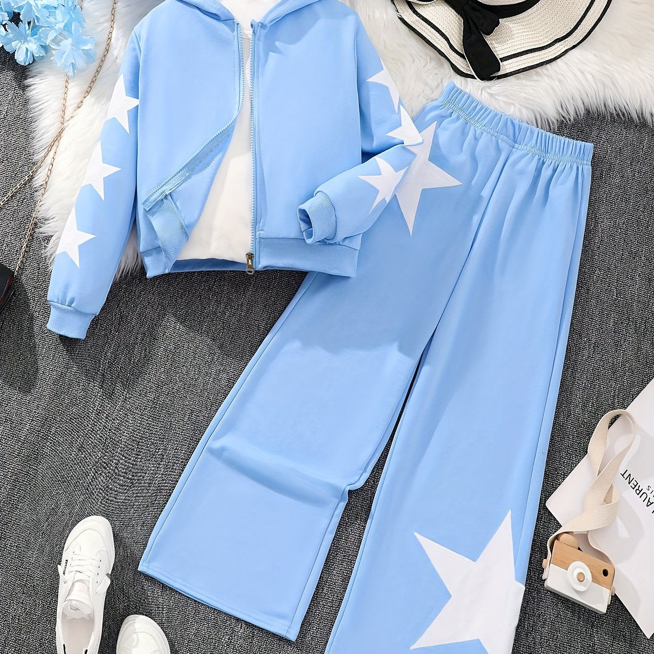 Polyester zip-up hoodie and pants set for girls with star pattern. Machine washable for easy care. Ideal for casual fall/winter outfits and outdoor activities.