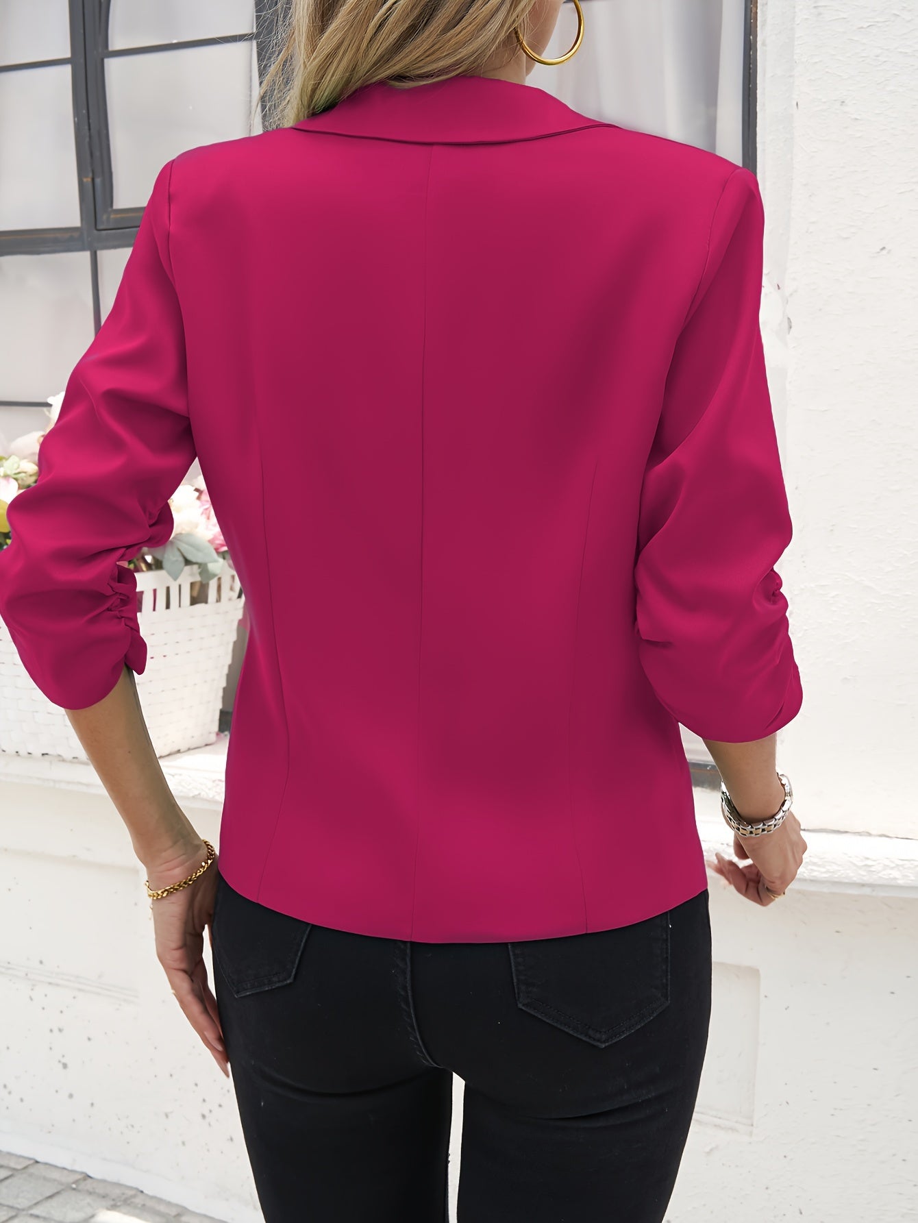 Stylish button-up tunic blazer for office wear, featuring a lapel and long sleeves in solid colors.