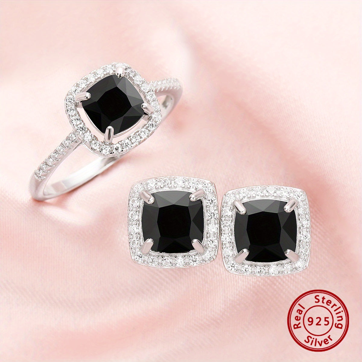 Set of elegant jewelry comprising of three pieces - two earrings and one ring, made of 925 sterling silver and inlaid with black zircon. This set symbolizes romance and mystery, making it perfect for parties and special occasions. The total weight of