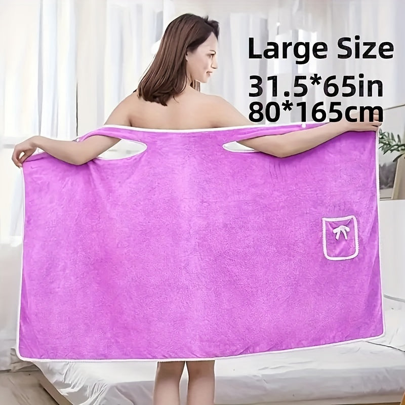 Soft coral velvet wearable bath towel with bow detail, ideal for bathroom and beach use. Thich, absorbent, quick-dry, pink with white border. Durable woven texture. Perfect for everyday comfort.