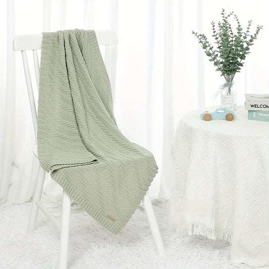 Soft, solid color blanket perfect for home and travel use, hand-knitted with care.