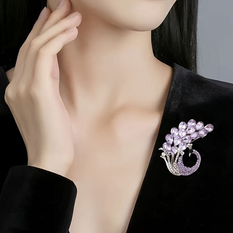 A beautiful purple crystal brooch pin, featuring an elegant and unique design with rhinestones. This fashion accessory is made from high-quality alloy material and showcases a stunning peacock design, perfect for women who appreciate stylish and