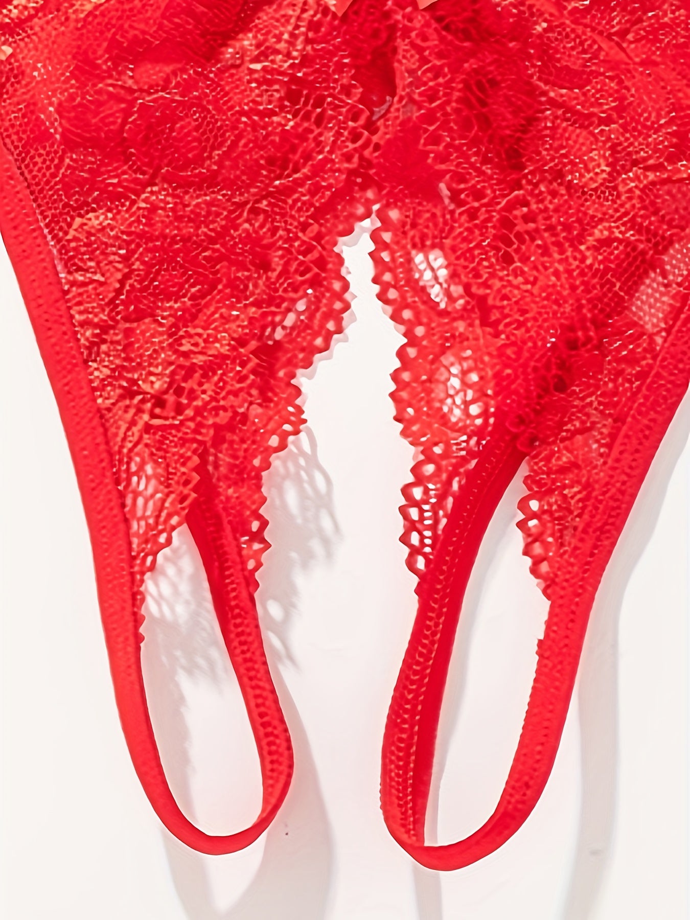 Floral lace thong with open crotch and bow detail - Women's lingerie.