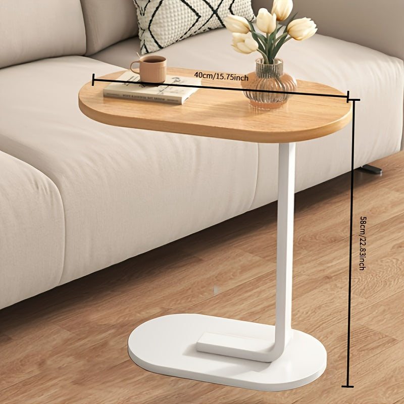 Modern C-shaped sofa side table made of walnut wood and iron, with a sturdy black frame. Compact and durable design suitable for various spaces.