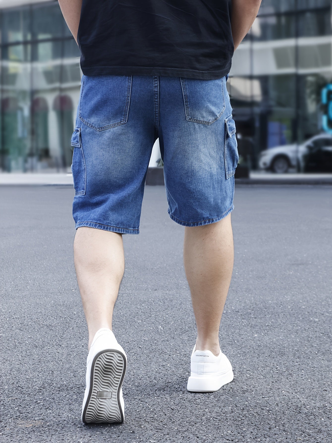 Men's plus size light blue denim shorts with casual fit, pockets, and classic style for casual attire.