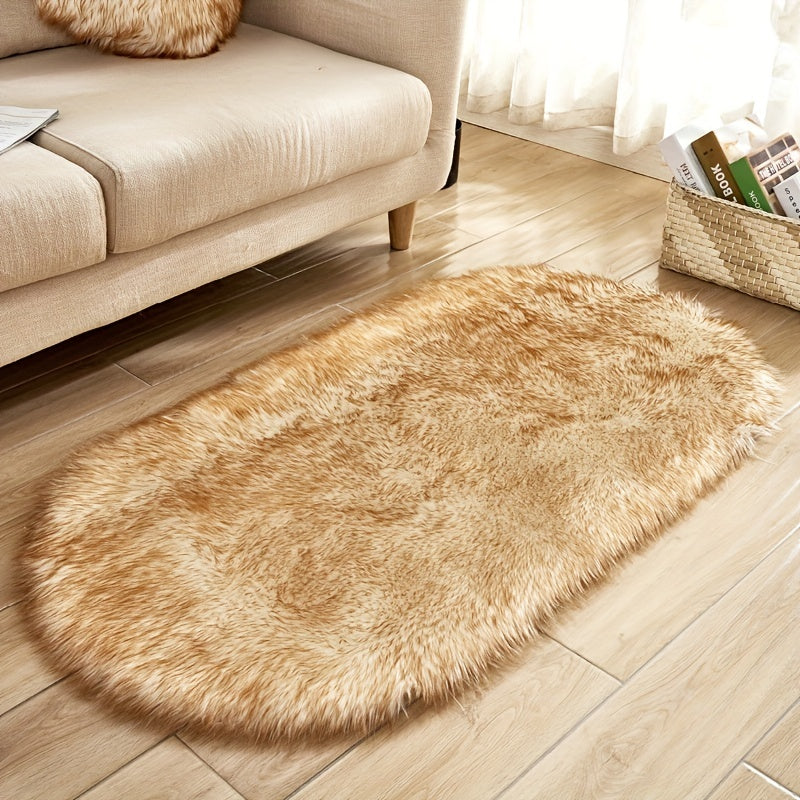 Soft and plush faux sheepskin oval area rug, perfect for adding a cozy touch to any living room or bedroom. Machine washable and designed to be used as a bedside rug. This shaggy plush carpet will enhance your home decor and add a touch of luxury to any