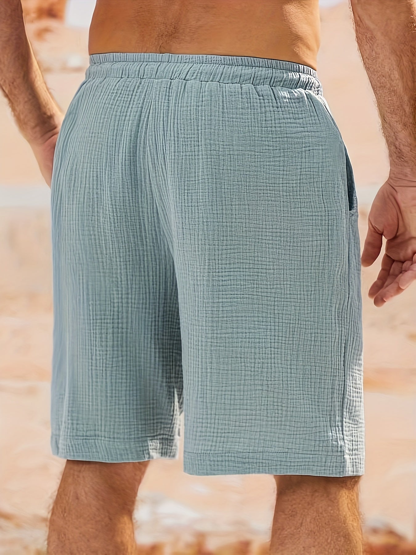 Men's solid color woven casual shorts with pockets, loose fit, perfect for beach, vacation, or weekend casual wear.