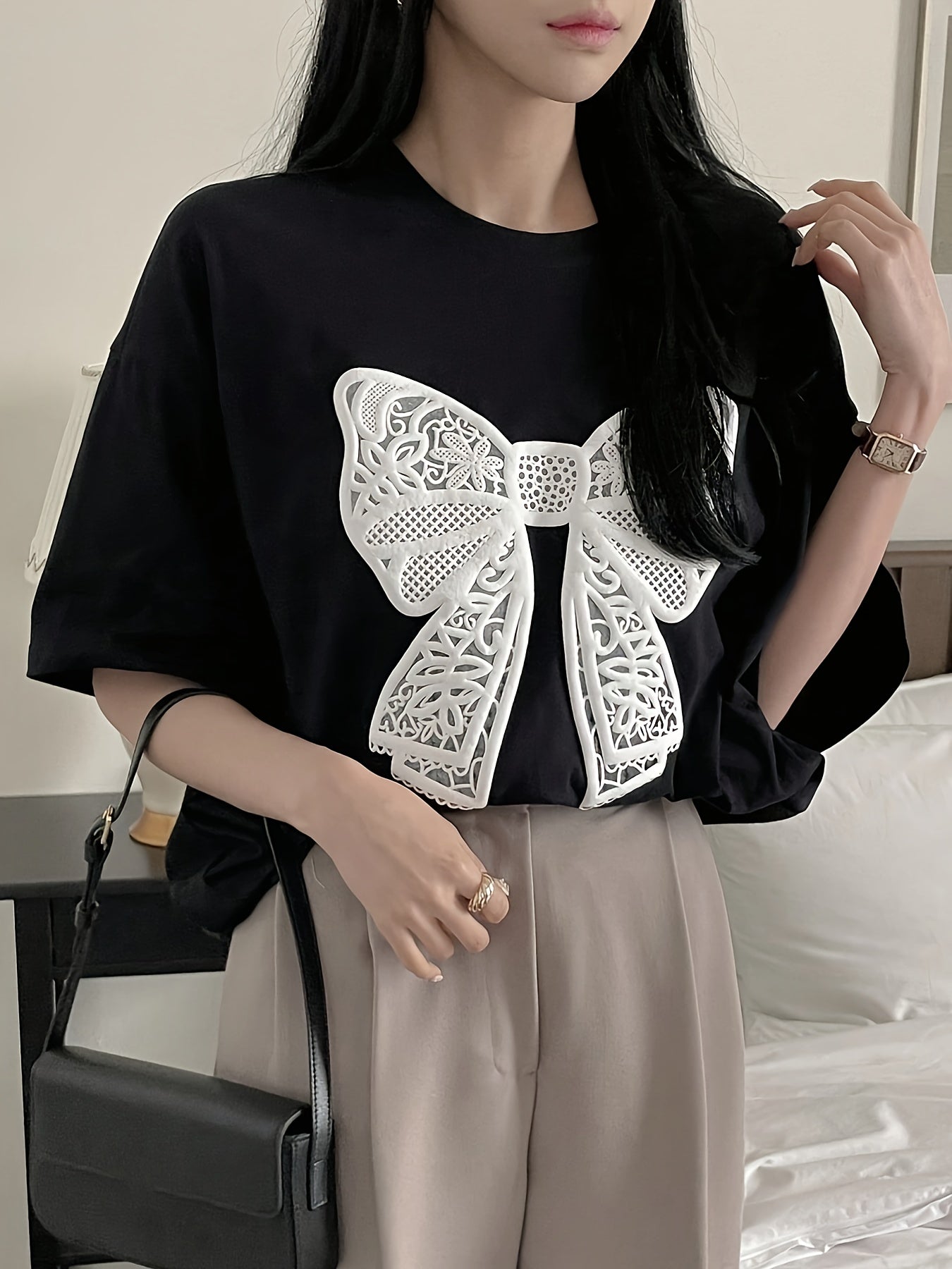 Women's casual crew neck t-shirt with lace bow pattern for spring and summer.