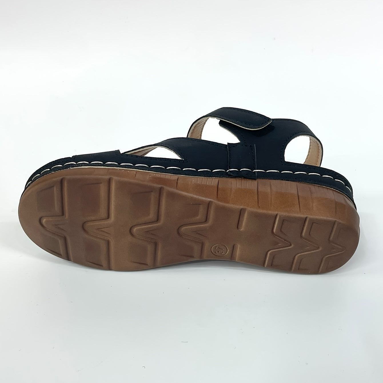 Minimalist black wedge sandals with open toe T-strap design and hook-and-loop closure. Features breathable PU upper and insole, solid color mid heel wedges perfect for casual beachwear.