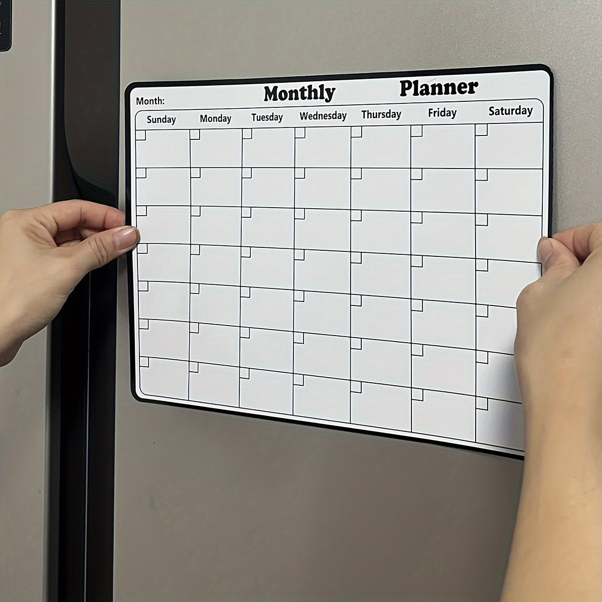 One piece of a dry erase fridge magnetic calendar, featuring a white board design perfect for refrigerators. This magnetic calendar is great for keeping track of appointments and events in the kitchen, serving as a decorative and functional addition to