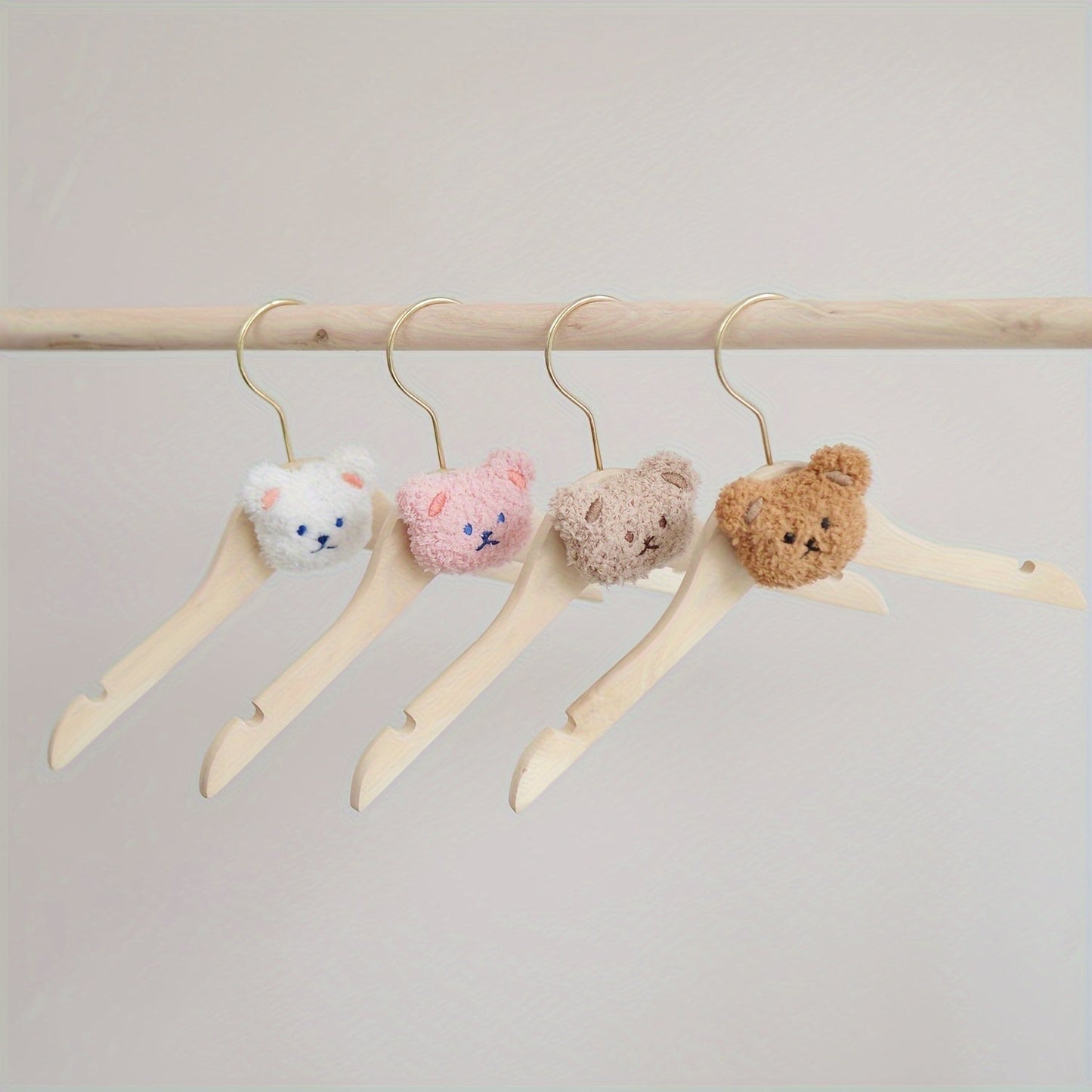 Durable and Lightweight Wooden Clothes Hangers featuring a Nordic Style Cartoon Bear Design, with Swivel Hooks for easy maneuvering. Recommended for Ages 14 and up.