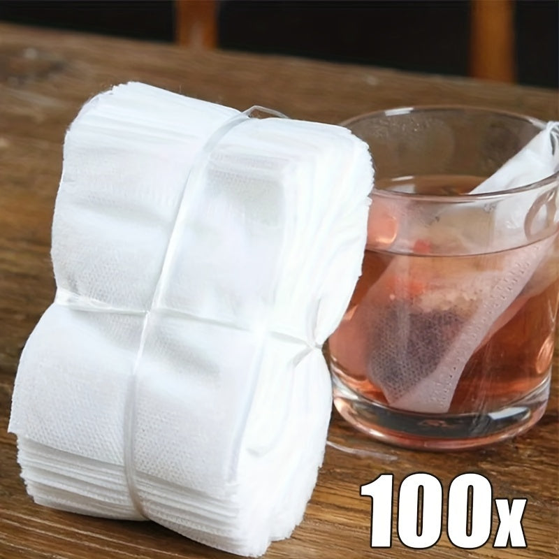 100 pieces of high-quality disposable tea and coffee filter bags with a convenient drawstring closure - ideal for brewing loose leaf tea, aromatic teas, and spices.