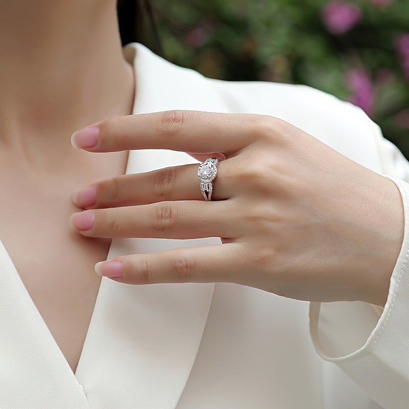 925 Sterling Silver Promise Ring featuring a 1ct Moissanite stone with an 18k Gold Plated Classy Halo Design. This High Quality Engagement or Wedding Ring comes with a Certificate of Authenticity and a Gift Box included.