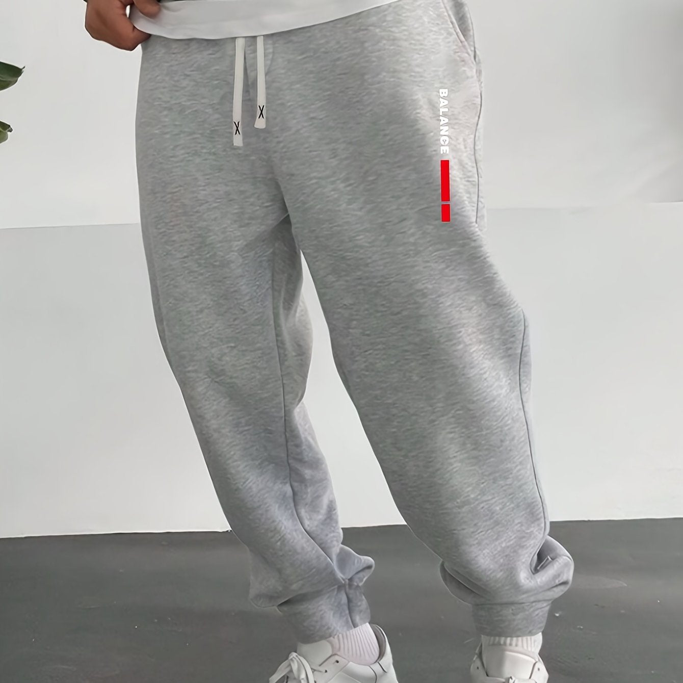 Casual men's sweatpants with letter print, made of polyester knit fabric with stretch. Regular fit with drawstring waist, comfortable for fall/winter.