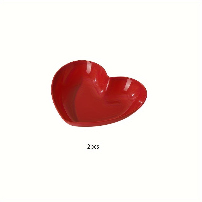 Heart-shaped plastic serving saucers in red for special occasions.