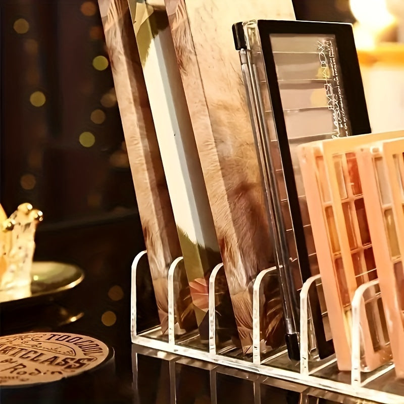 Transparent desktop makeup holder with 7 grids for eyeshadow palette and powder storage. Can be used in drawers or on desktops as a cosmetics organizer.