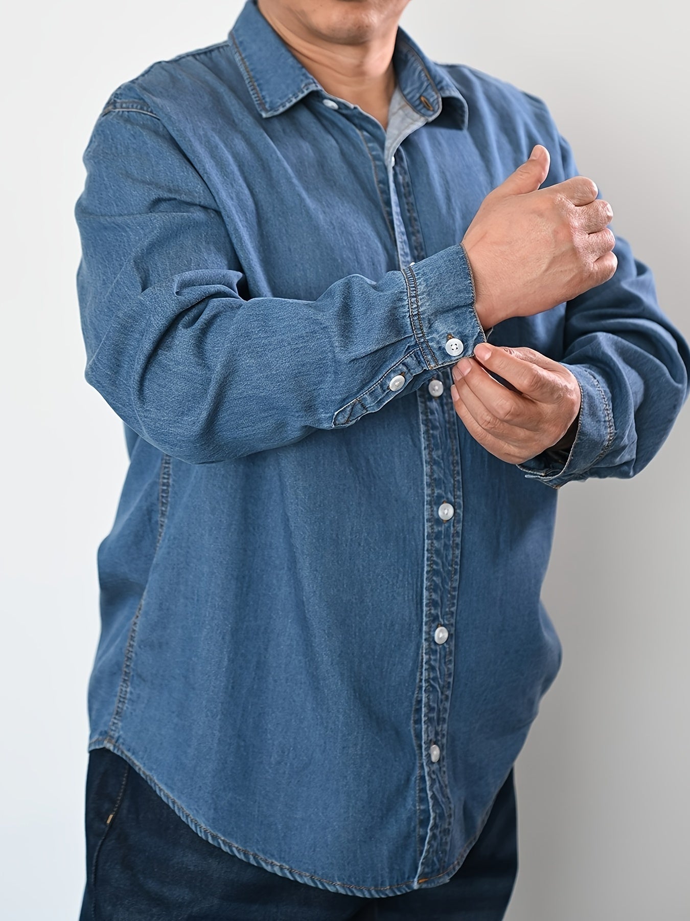 Men's plus size denim shirt, perfect for outdoor activities in spring and fall. Stylish, loose fit and breathable.