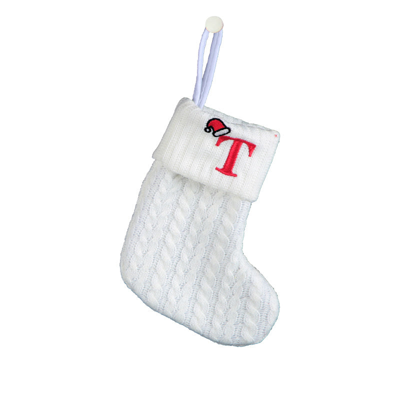 White cable knit stocking with embroidered 'F' - Ideal for indoor decor.