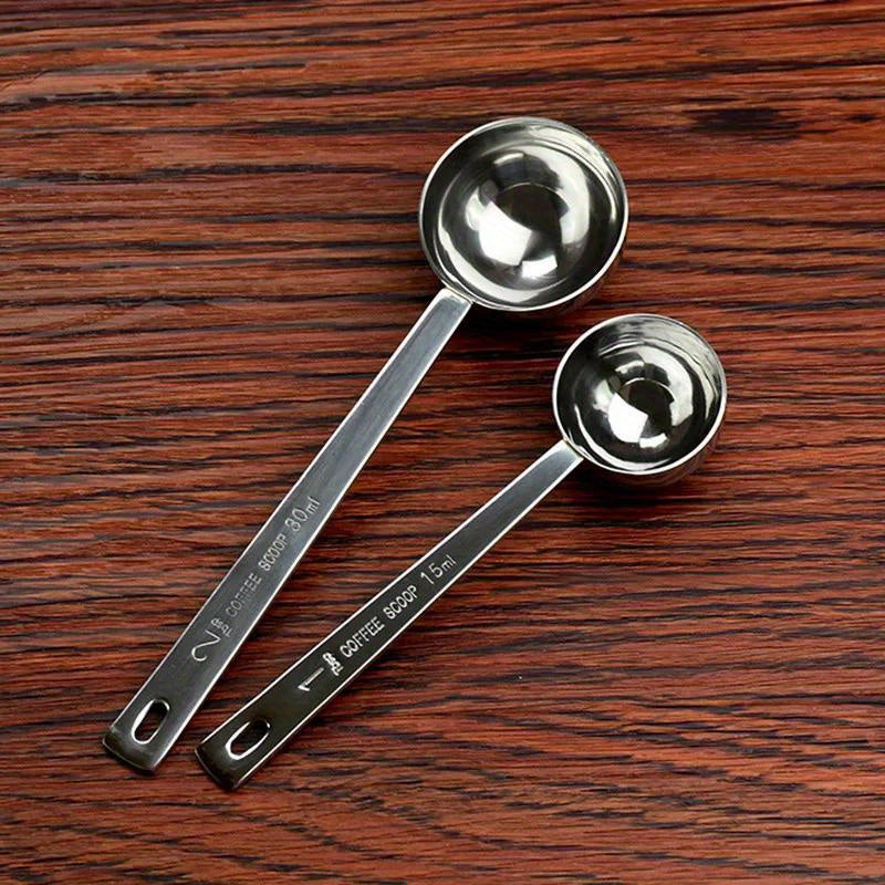 Set of 1 durable stainless steel measuring spoons for coffee, including a metal tablespoon coffee scoop. This kitchen baking tool accessory is built to last.