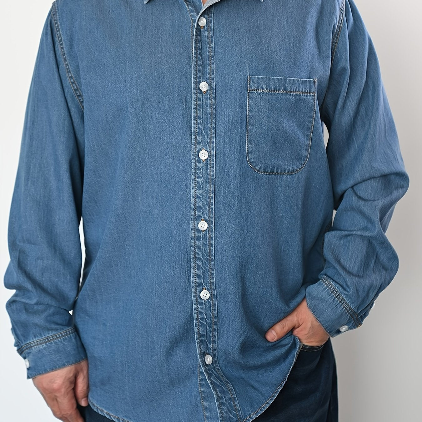 Men's plus size denim shirt, perfect for outdoor activities in spring and fall. Stylish, loose fit and breathable.