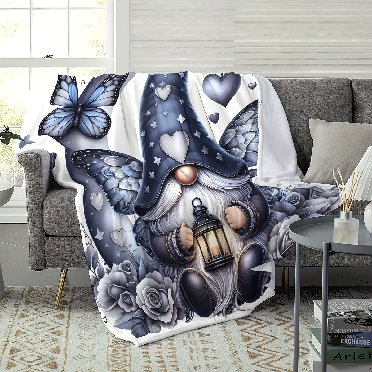 Soft, warm, and cozy, this flannel throw blanket features an enchanted gnome and butterfly print. Perfect for the couch, bed, office, or travel, this versatile all-season gift is sure to bring comfort and style to any space.