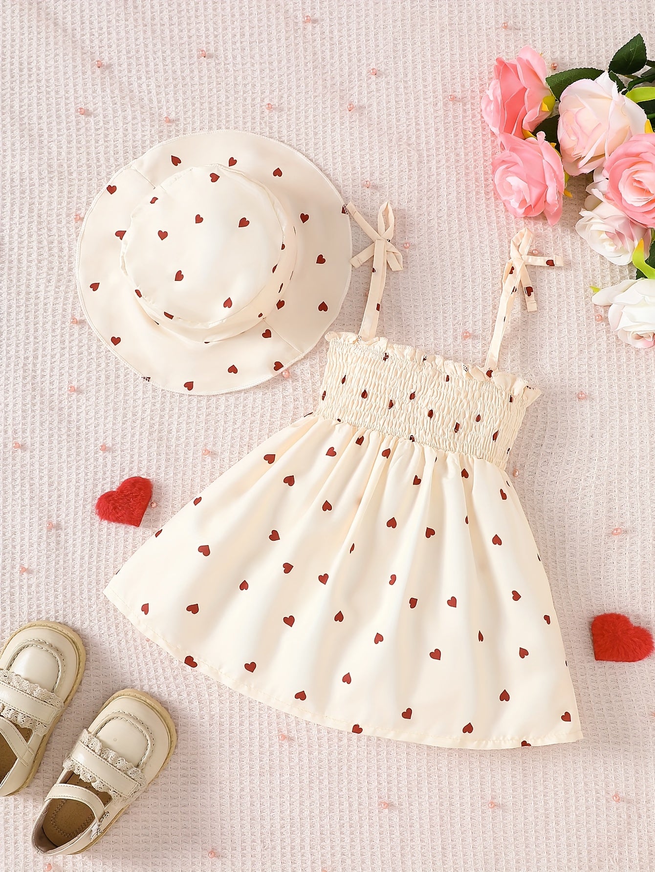 Girls' sleeveless umbrella skirt dress with peach heart print, drawstring suspender, perfect for summer outdoor wear.