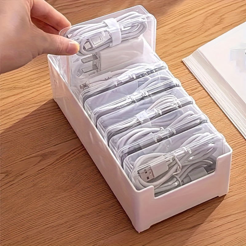 Get organized with 1 large white box and 7 small transparent boxes for cables and chargers.