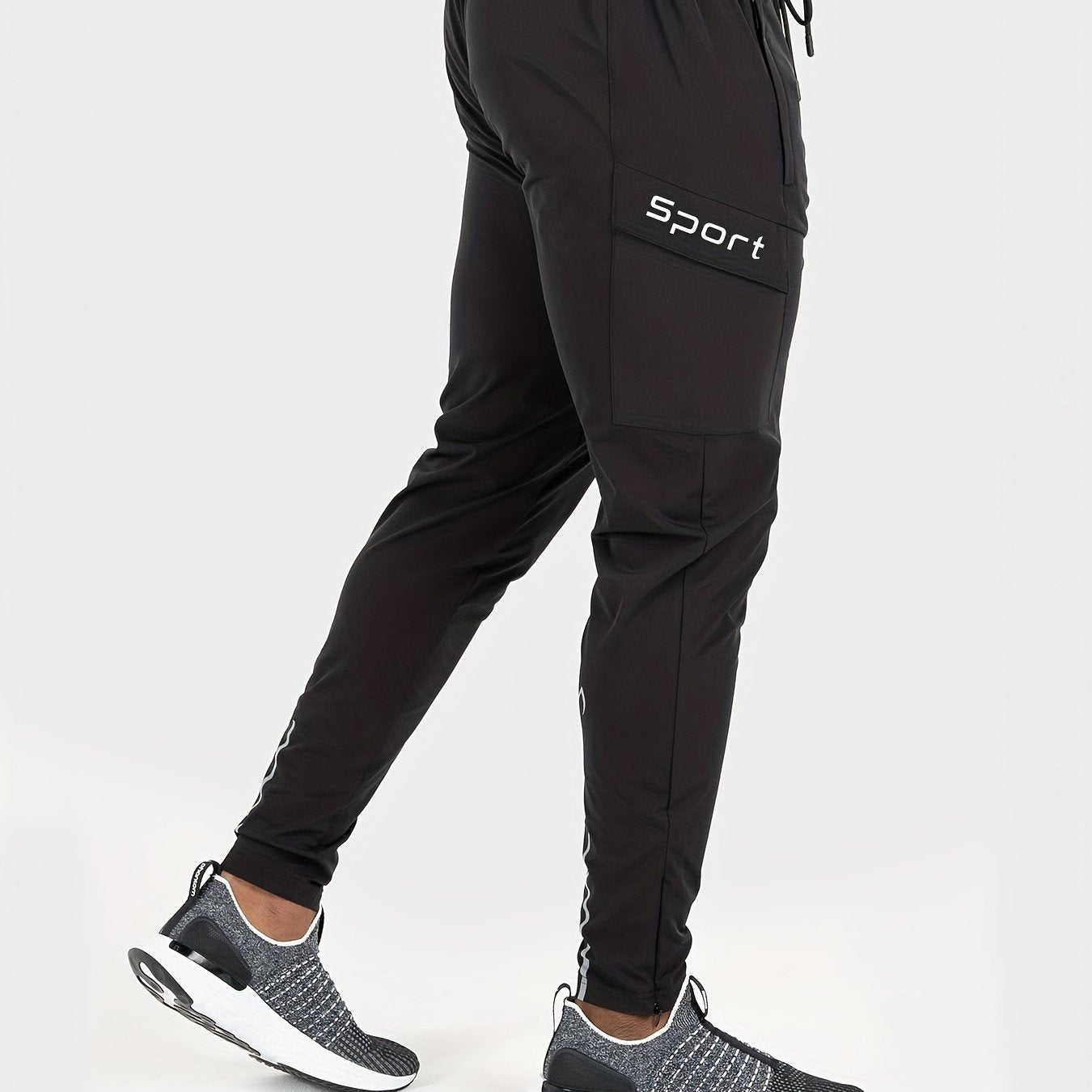 Men's athletic joggers, black - breathable, water-resistant, UV protection with side pockets for running, hiking, and outdoor activities.