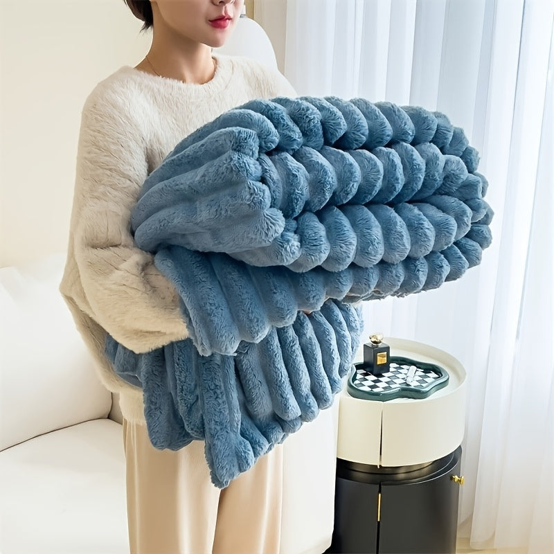 Soft, warm, and luxurious, this contemporary double-sided faux rabbit fur throw blanket is perfect for cuddling up on the couch or bed. Made of polyester knit, it is machine washable for easy care. Whether you're at home or on the go, this all-season